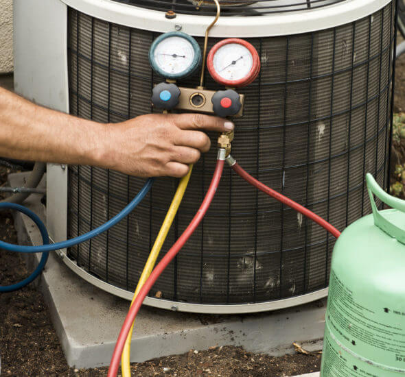 Tech Checking Air Conditioner