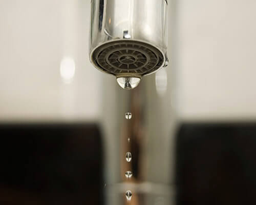 Water Dripping from Faucet