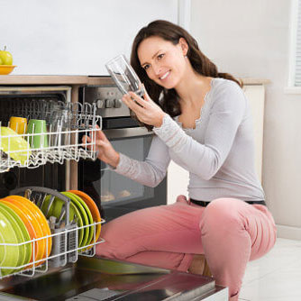 Woman Smelling Dishwasher Odor